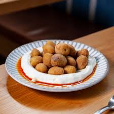 Balaboosta signature dishes Fried Olives
Whipped Feta
Brick Chicken